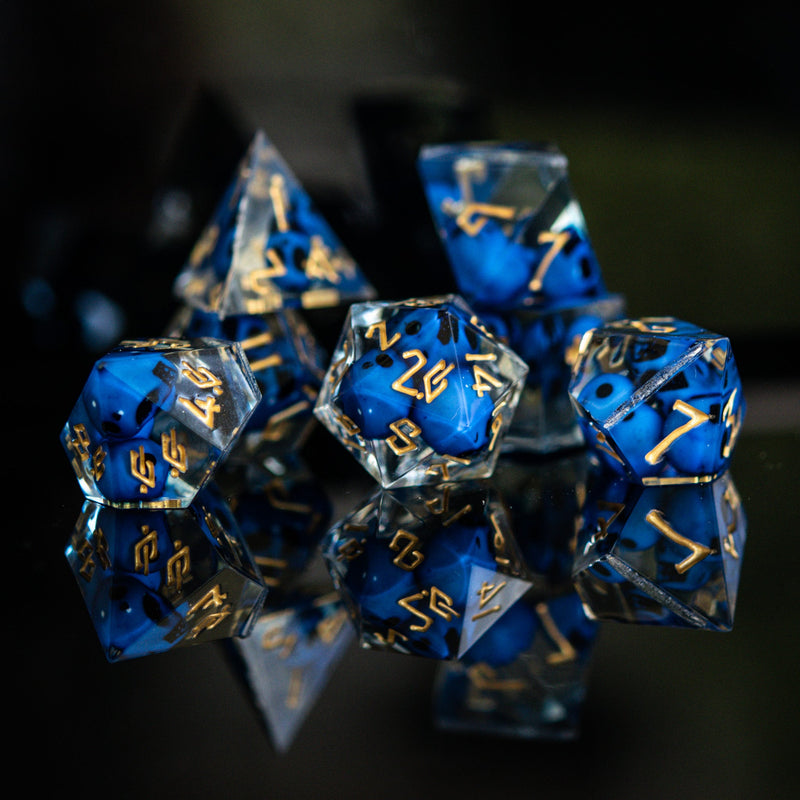 Load image into Gallery viewer, Corpse Blue and Gold Sharp-Edged Resin Dice Set
