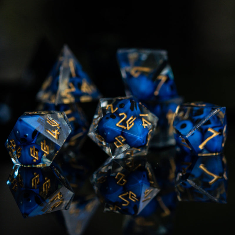 Load image into Gallery viewer, Corpse Blue and Gold Sharp-Edged Resin Dice Set
