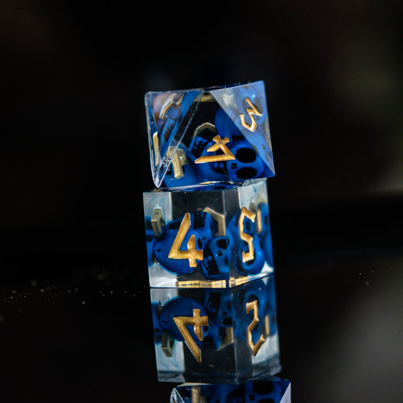 Load image into Gallery viewer, Corpse Blue and Gold Sharp-Edged Resin Dice Set
